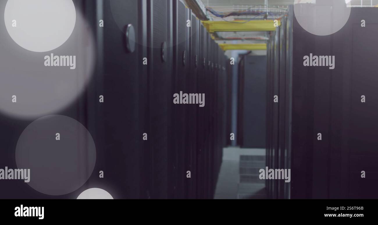 Image of spots of light and data processing over computer servers Stock Photo