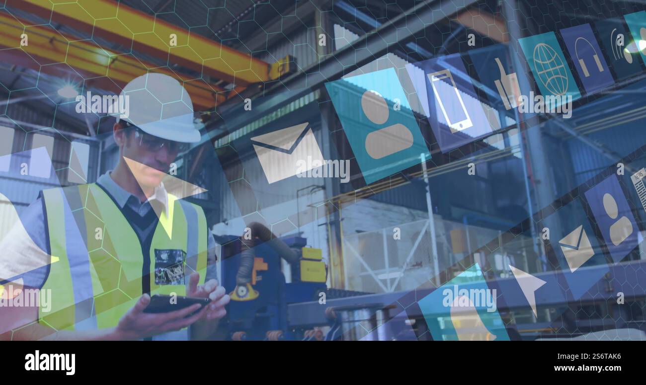 Using smartphone, construction worker with hard hat over digital icons image Stock Photo