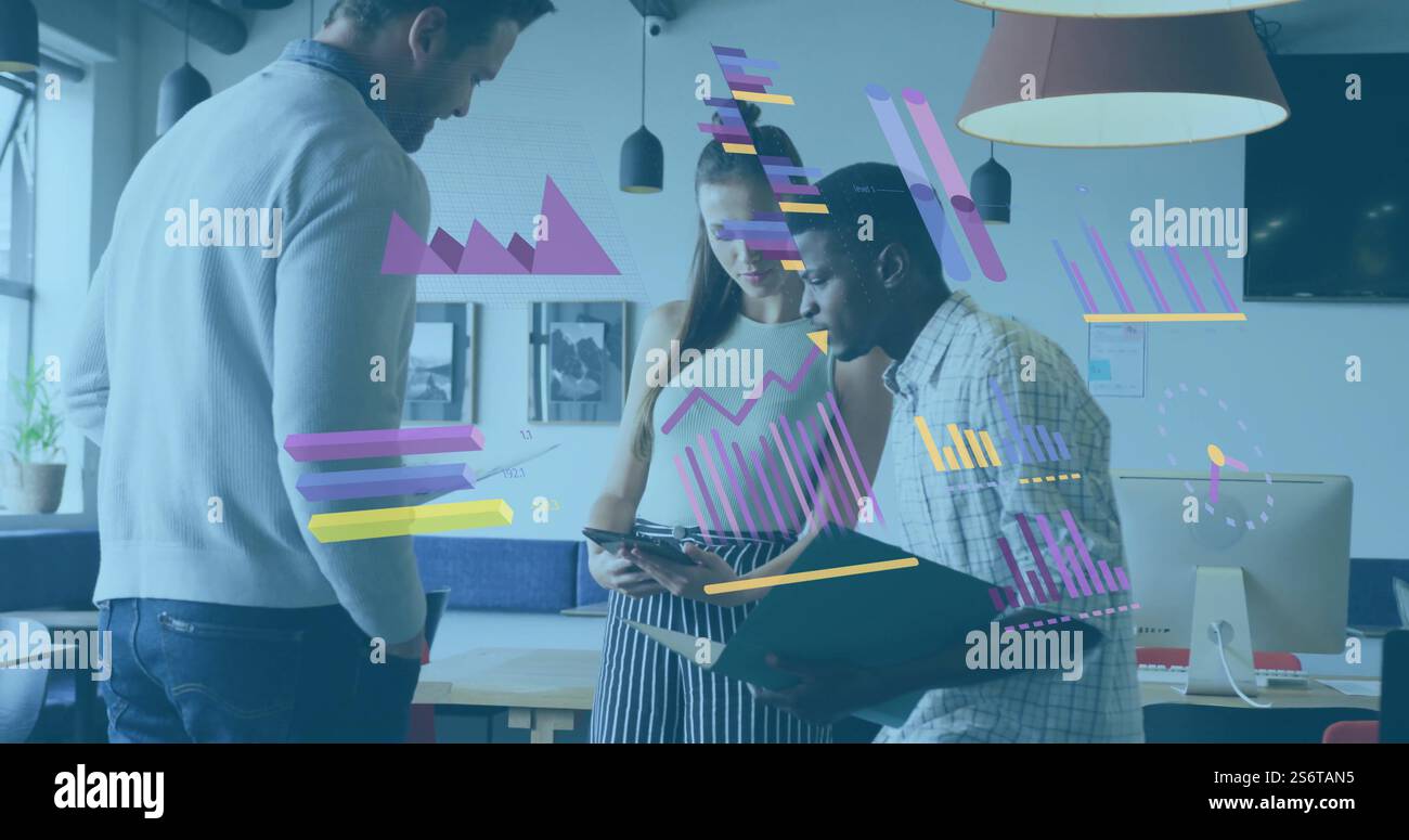 Business data analysis image over diverse colleagues discussing documents in office Stock Photo