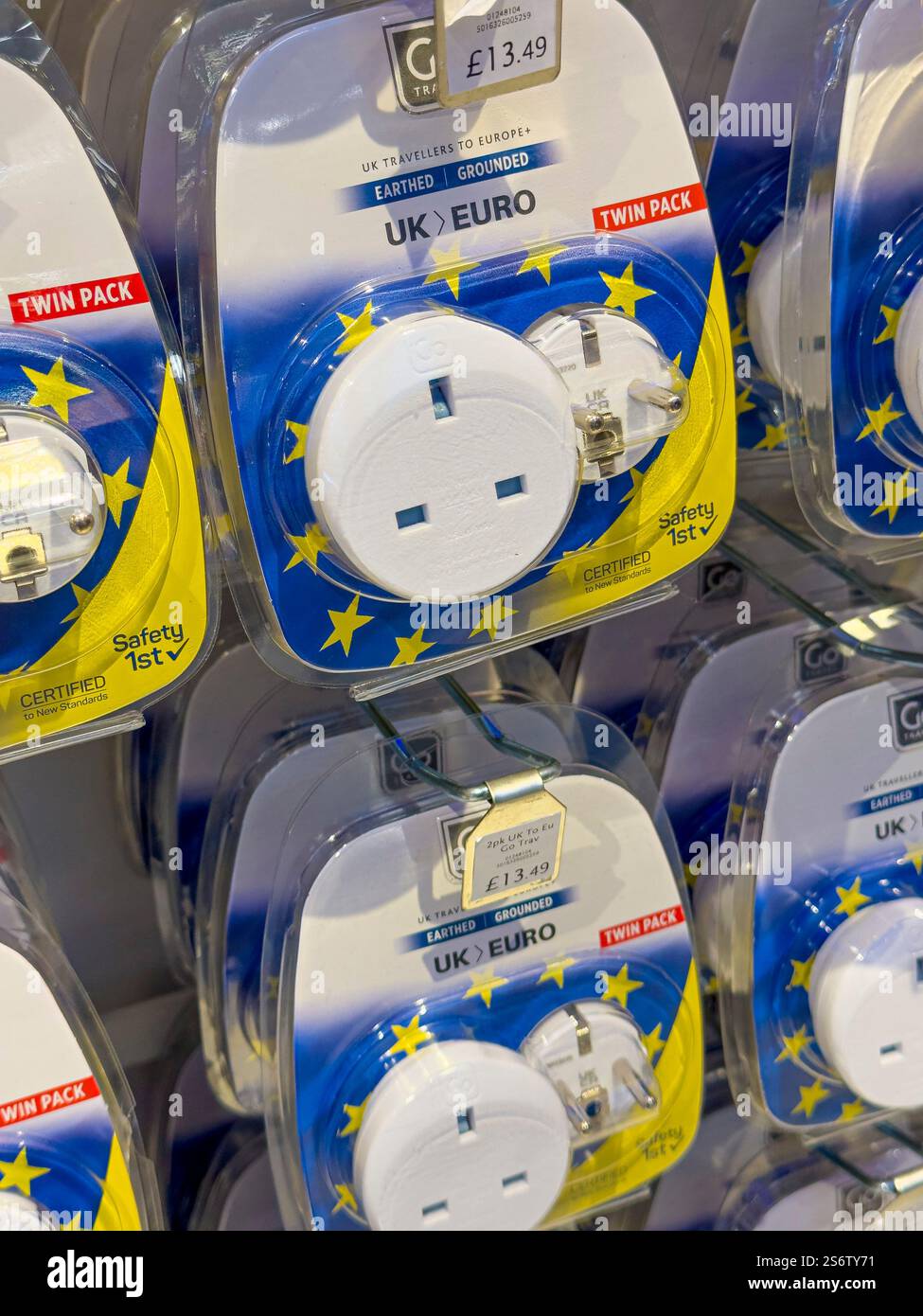 Adapter plug, between European and UK plugs Stock Photo