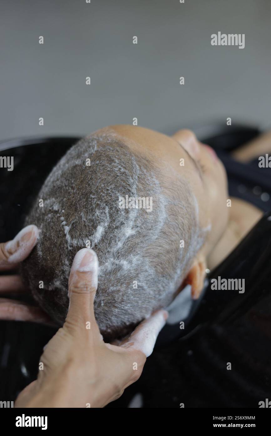 woman having a head wash, beauty salon spa concept Stock Photo