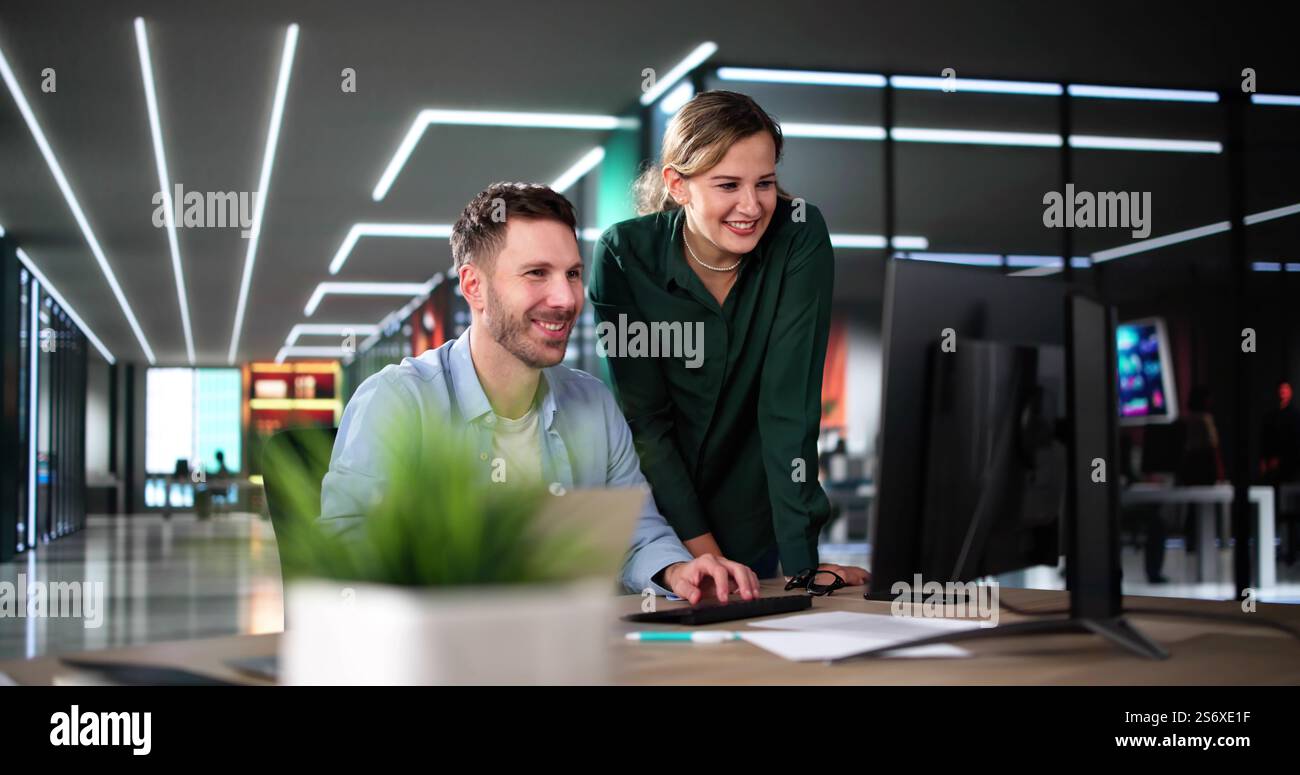 Business Data Analysts Man And Woman Using Computer Stock Photo