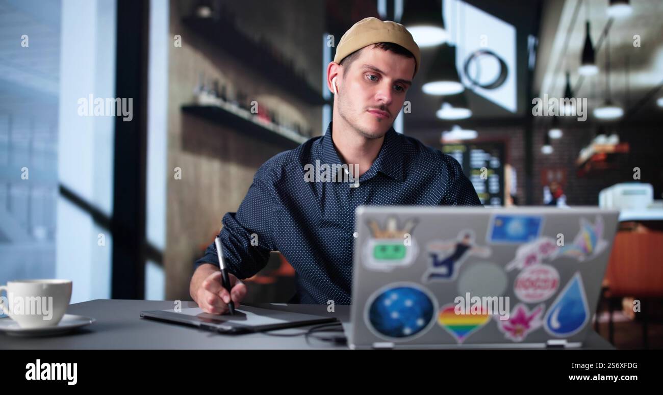 Graphic Photo Designer Using Computer Screen And Tablet Stock Photo