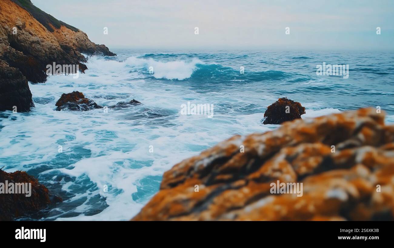 Dramatic crashing waves and foaming sea spray against a rugged granite ...