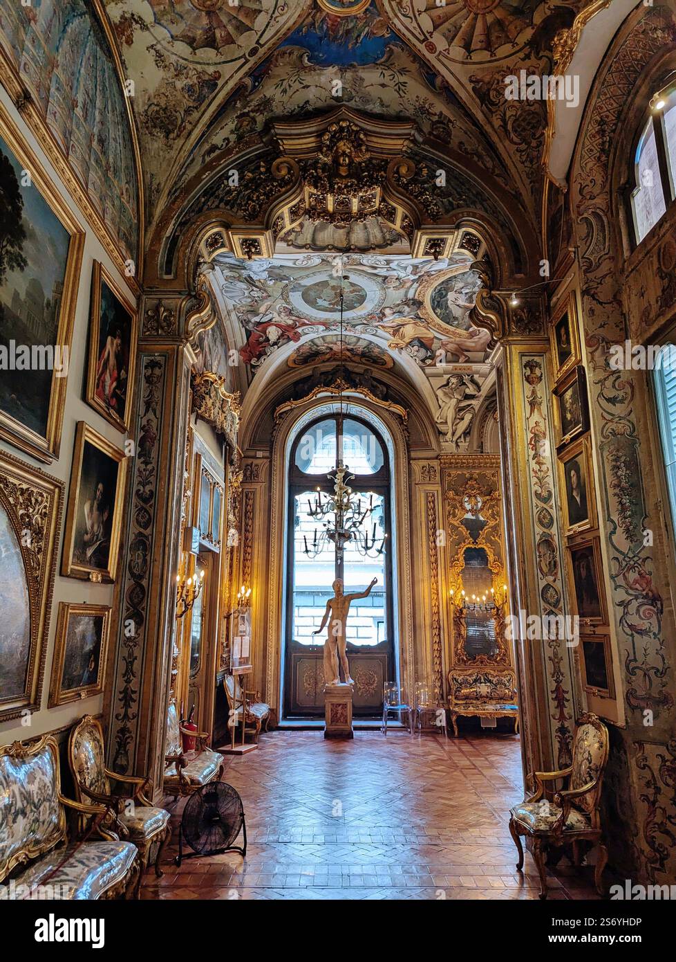 A lavishly decorated Baroque-style hall with intricate frescoes, gilded details, and classic artwork. - Smartphone Captured Stock Image