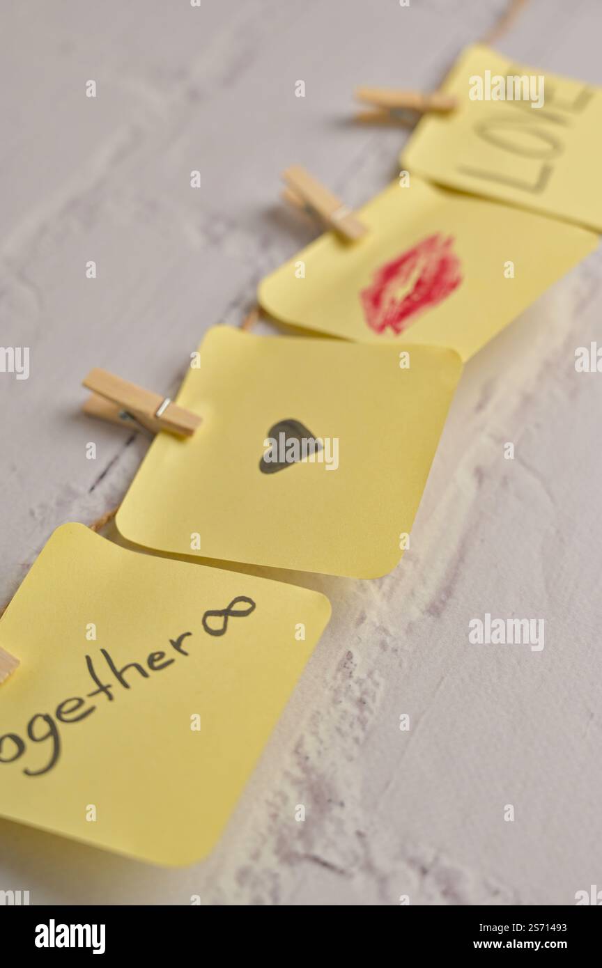 Four yellow sticker papers with lipstick kiss mark, inscription