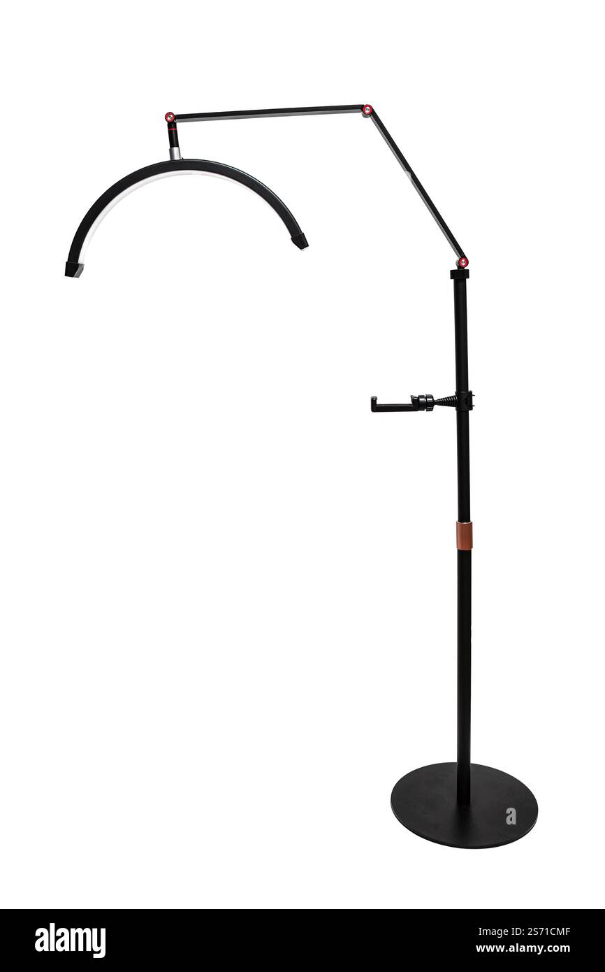 A sleek black floor lamp with an adjustable arm and curved LED light, perfect for modern interiors. Stock Photo