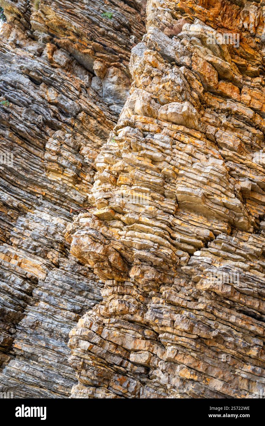 Layered rock texture in Budva, Montenegro. Sedimentary rocks with ...