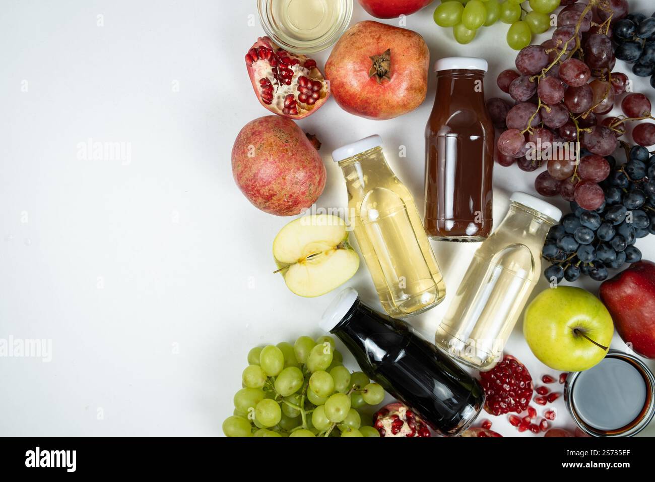 Different types of vinegar balsamic, apple, wine and pomegranate in glass bottles. Copy space for text Stock Photo