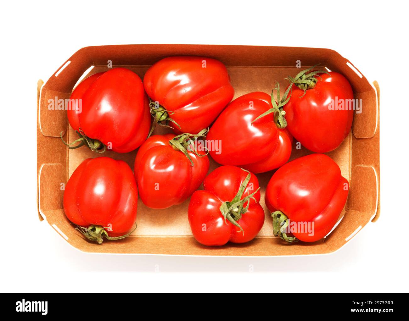 Small bright red deeply ribbed tomatoes isolated on White background ...