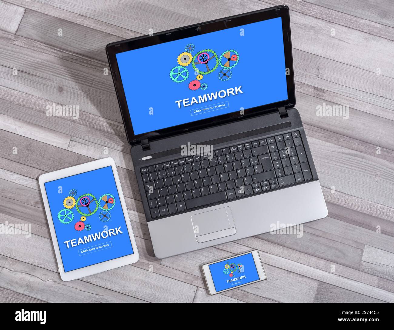Teamwork concept shown on different information technology devices Stock Photo