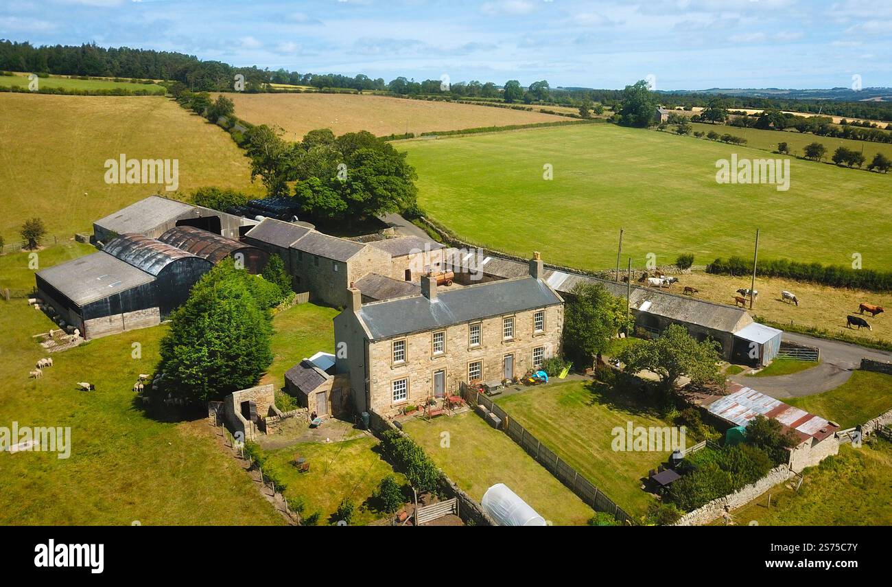 Aerial drone view of british rural farm house farmyard stone buildings ...