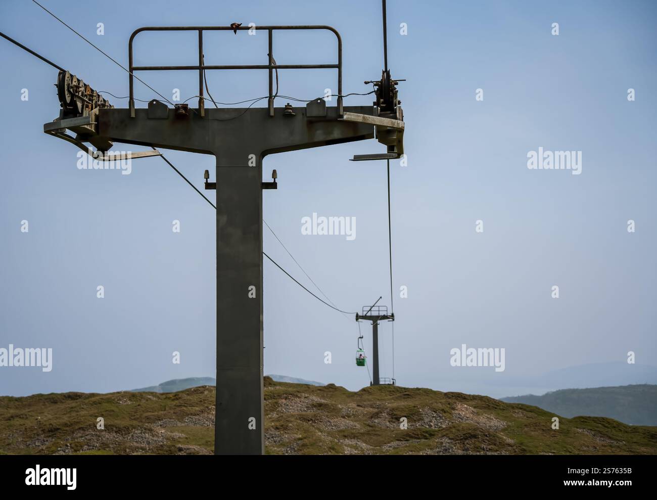 a passenger cable car gondola cabin travelling between pylons, opened ...