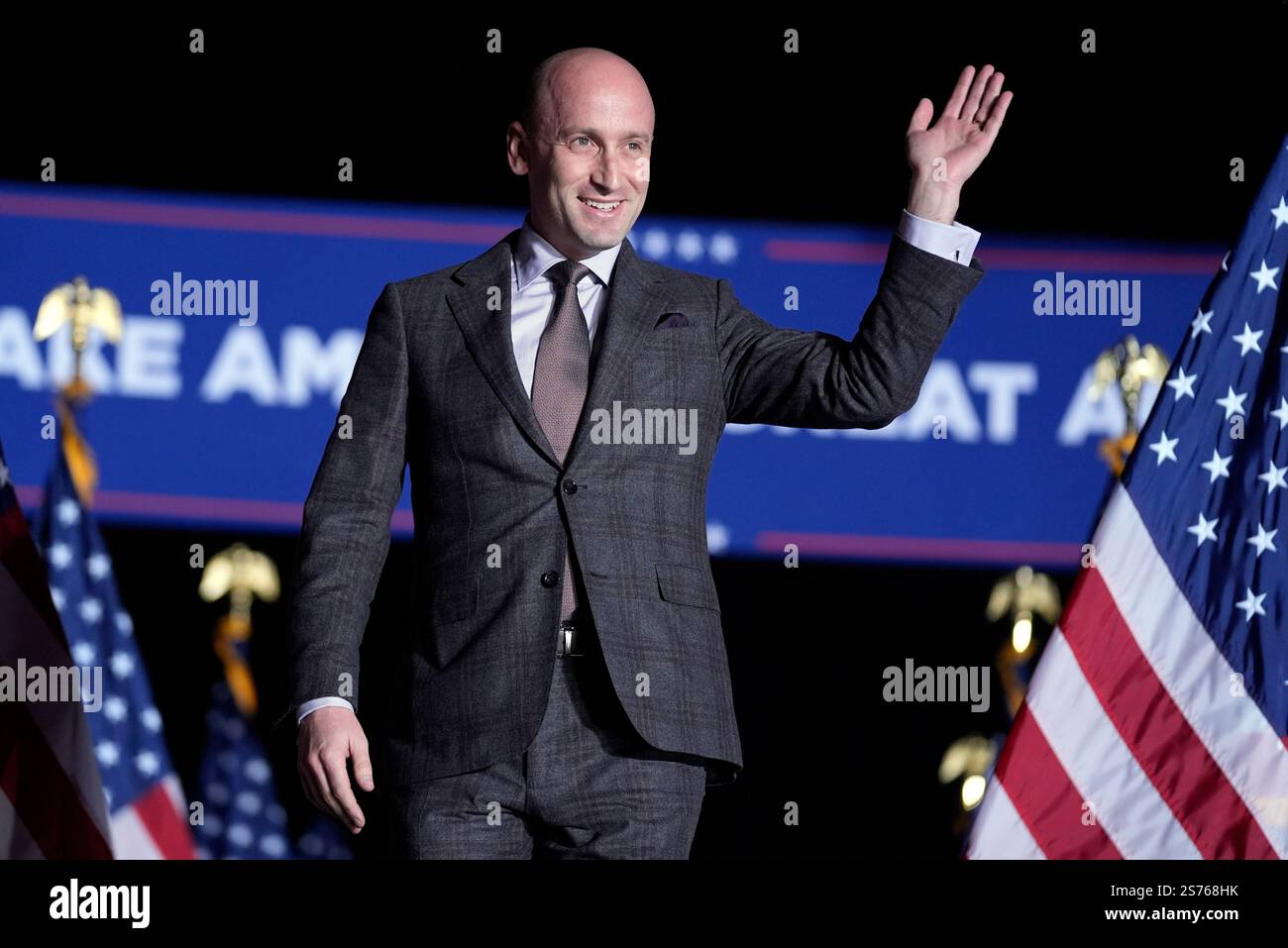 FILE - Stephen Miller waves as he arrives to a campaign rally for ...