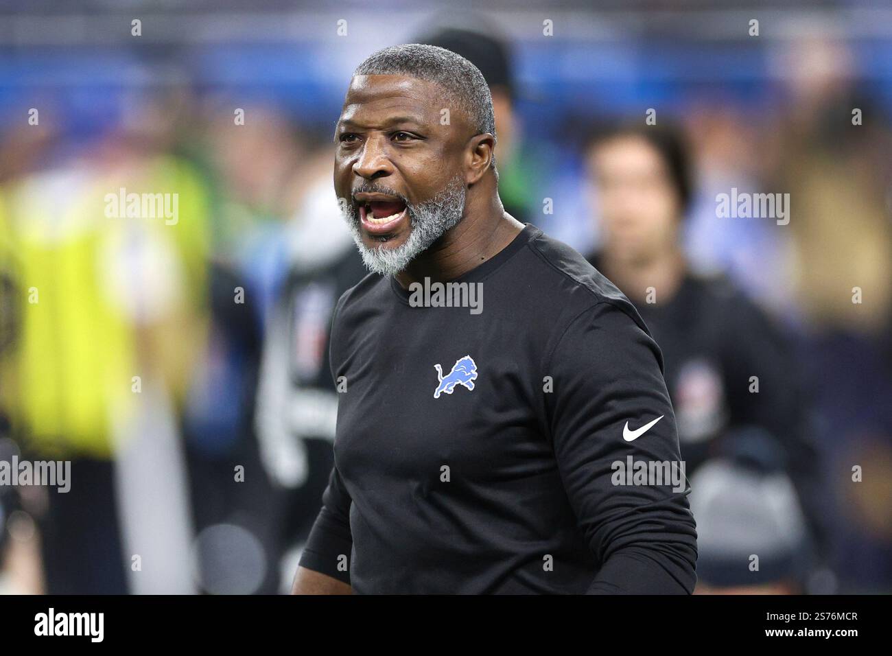 Detroit Lions defensive coordinator Aaron Glenn watches during warmups