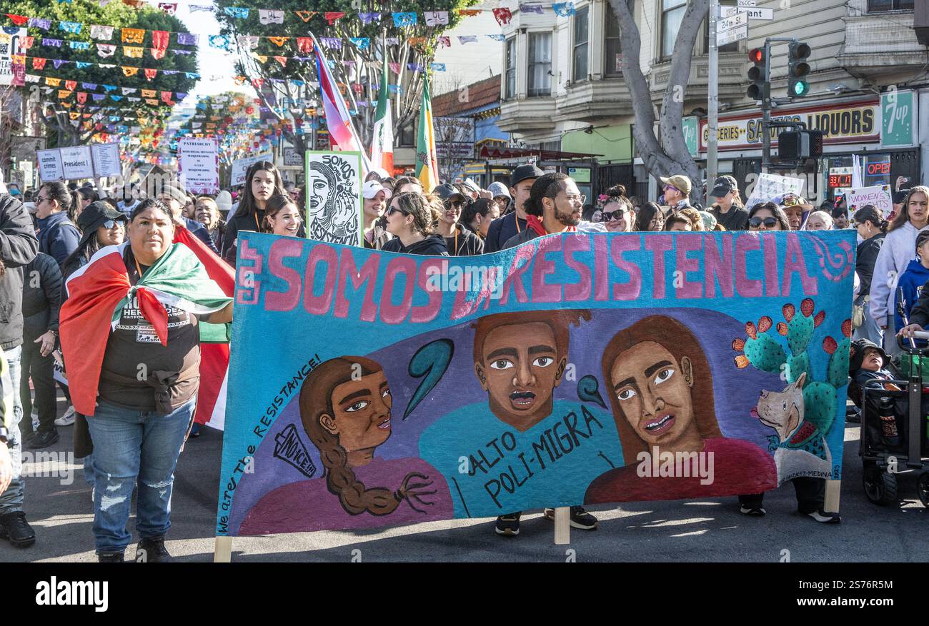 Women march behind a banner at the People's March in San Francisco on