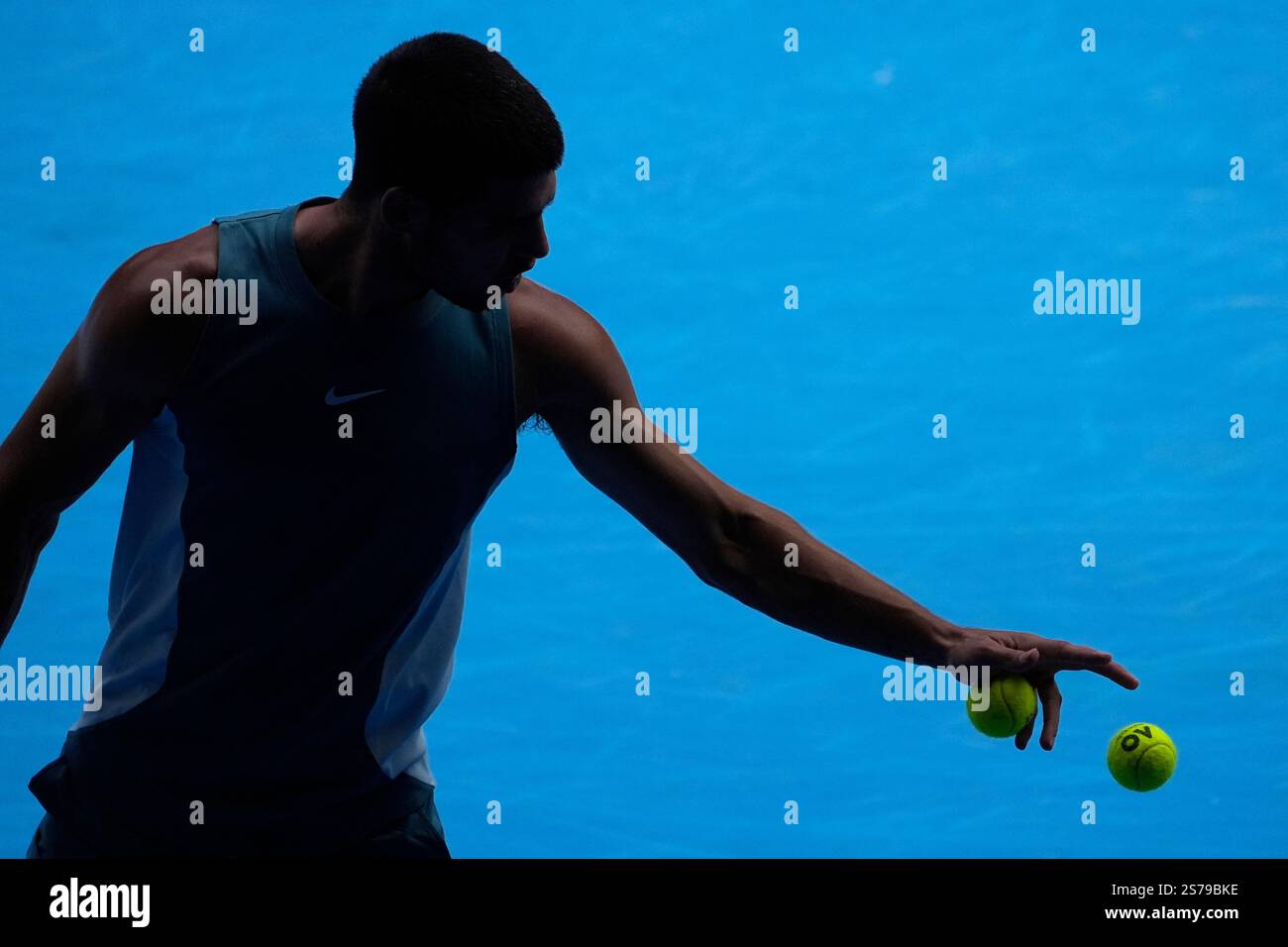 Carlos Alcaraz of Spain prepares to serve during a fourth round match