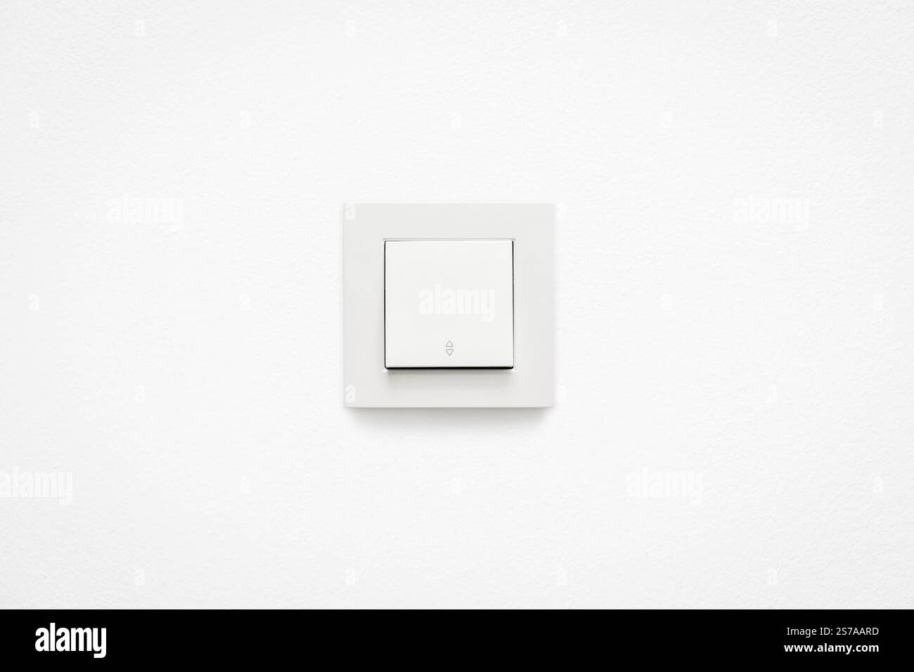 Cream colored wall mounted cream colored vavien or two-way light switch Stock Photo