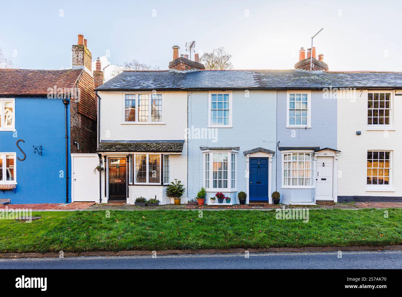Street scene of a row of pretty, colourful Georgian architecture cottages in the attractive village of New Alresford, Hampshire Stock Photo