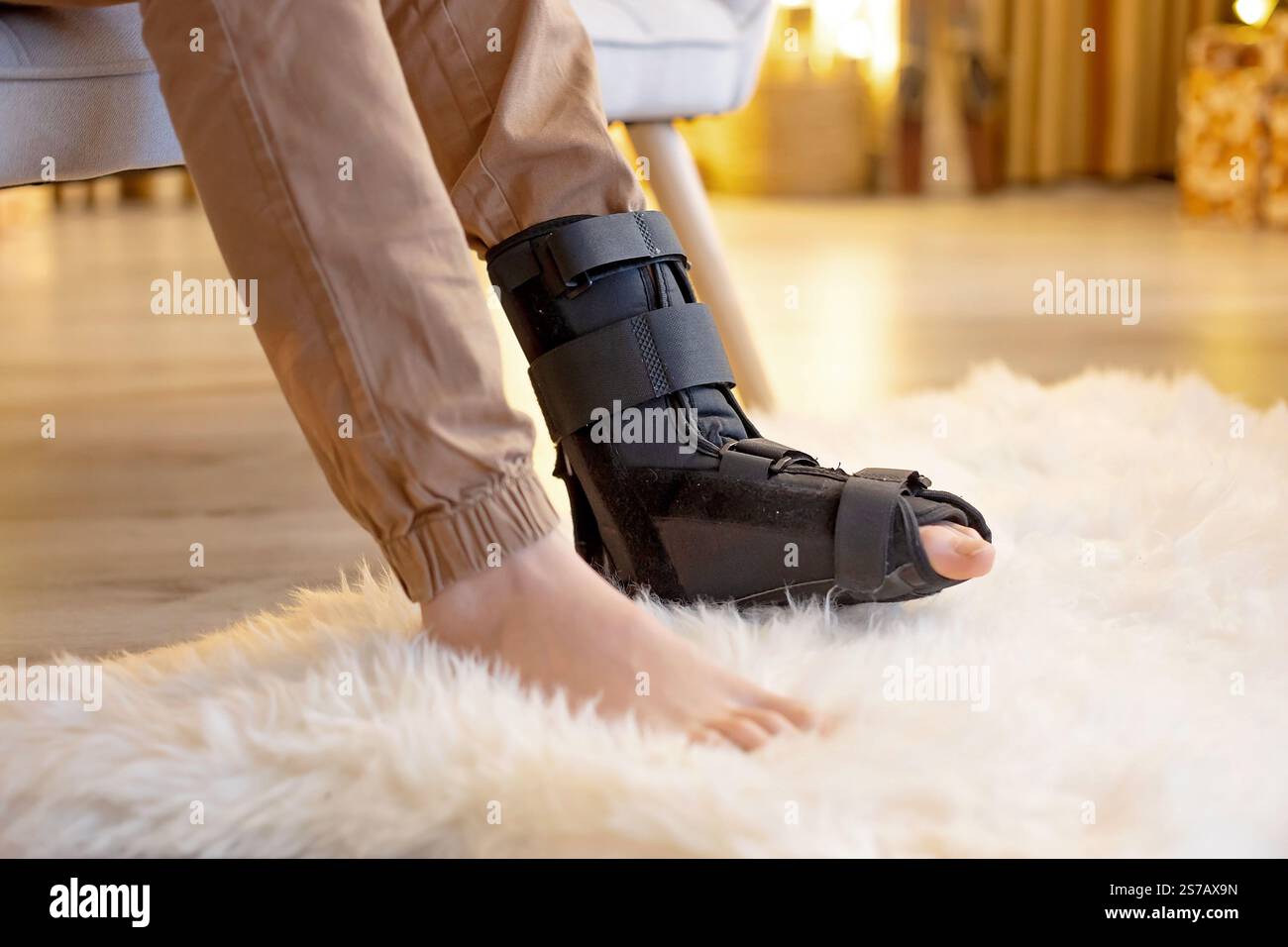 Child with fractured leg, broken foot, fixing boot. Kids in injury on ...