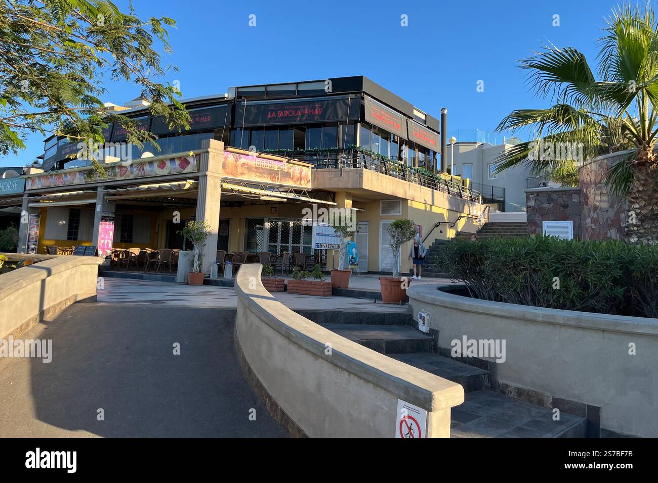 Restaurants Fañabe Sol and La Farola del Mar on the Costa Adeje Seafront by Playa de Fanabe. Tenerife, Canary Islands, Spain. 12th January 2025. - Smartphone Captured Stock Image