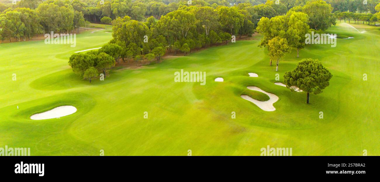 An aerial view of a golf course with sand traps and lush greenery Stock ...