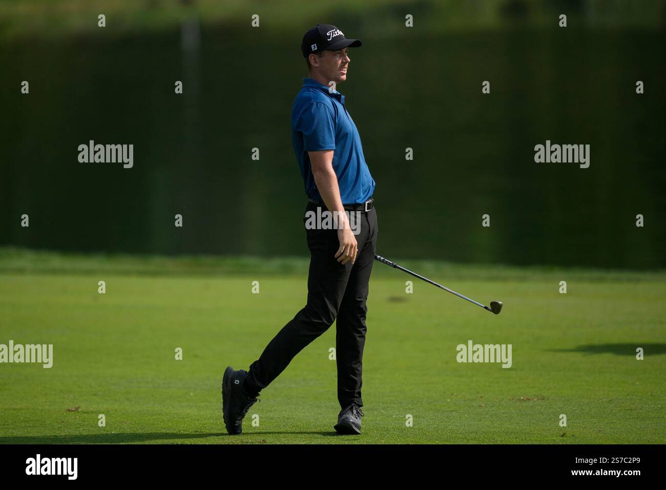 Daniel Hillier of New Zealand watches his shot from the 9th fairway