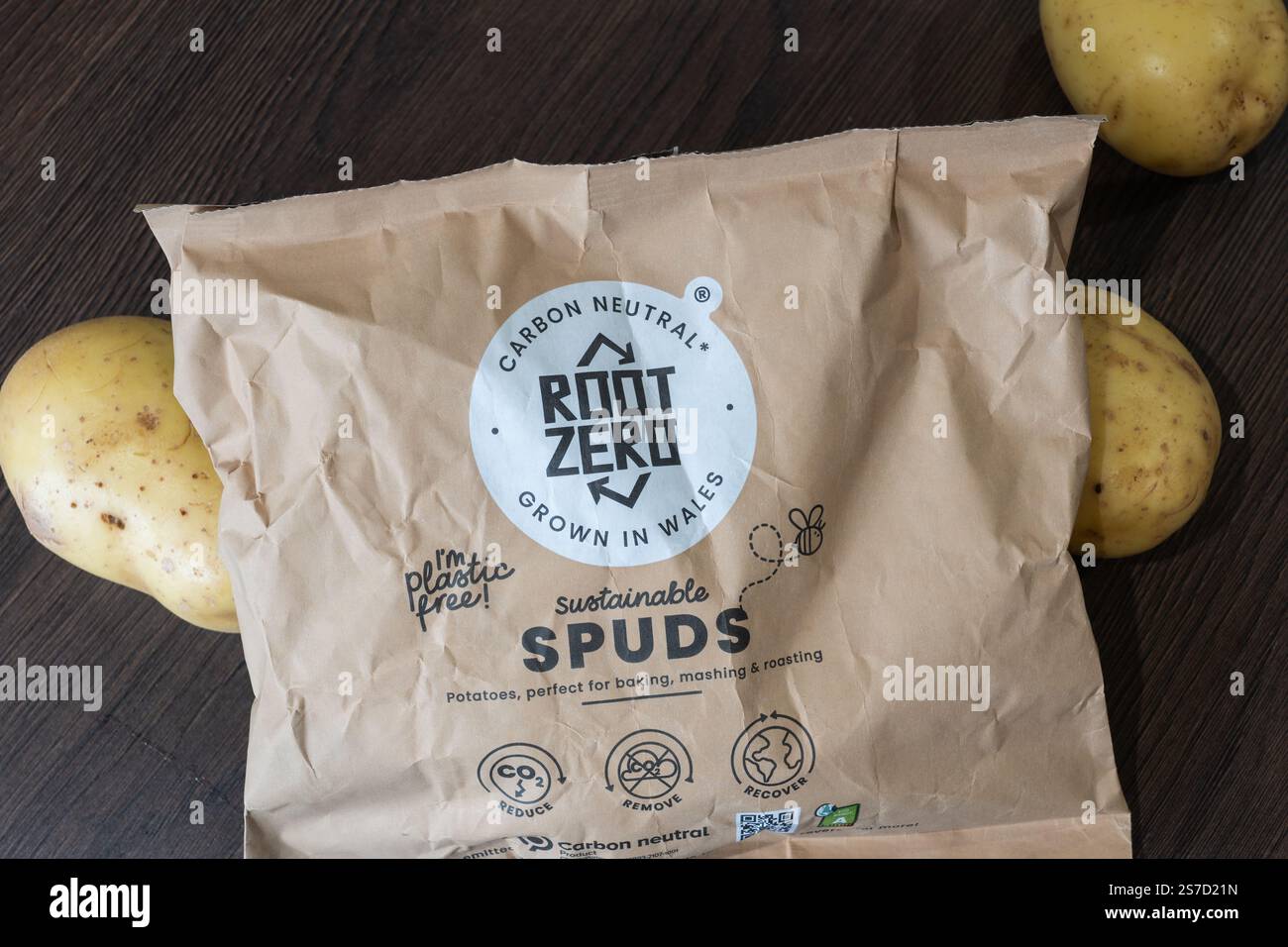 'Root Zero' Sustainable spuds (potatoes) grown in Wales, with plastic free paper packaging and carbon neutral. Root Zero promotes climate action. UK Stock Photo