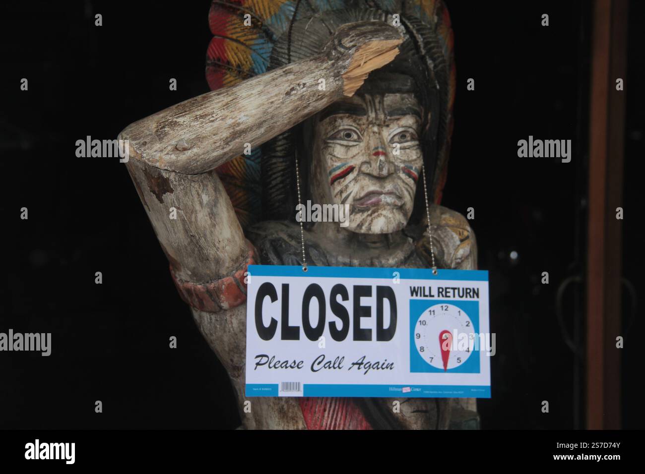Old Rustic Closed Sign Closed sign hanging from a wooden sculpture in front of an antique shop ...