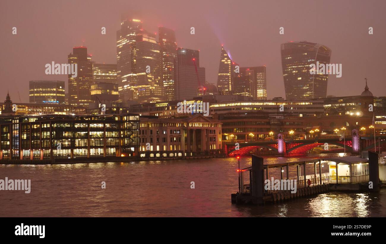 Night view from the south bank of the river Thames looking towards the City of London. Stock Photo
