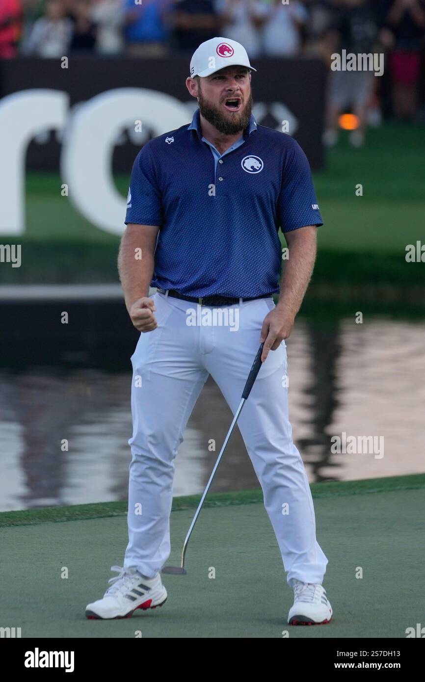 Tyrell Hatton of England reacts after winning the Dubai Desert Classic