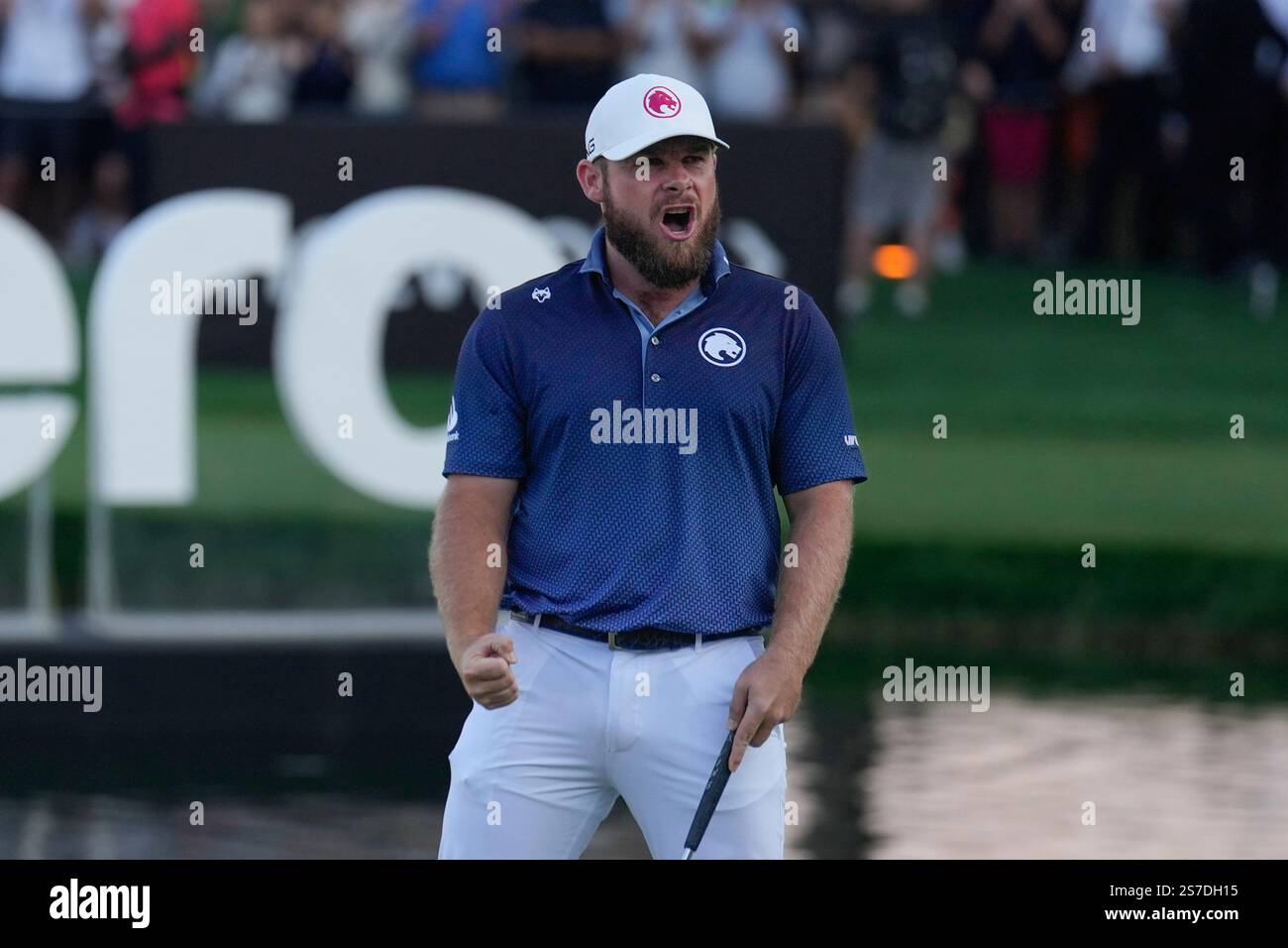 Tyrell Hatton of England reacts after winning the Dubai Desert Classic