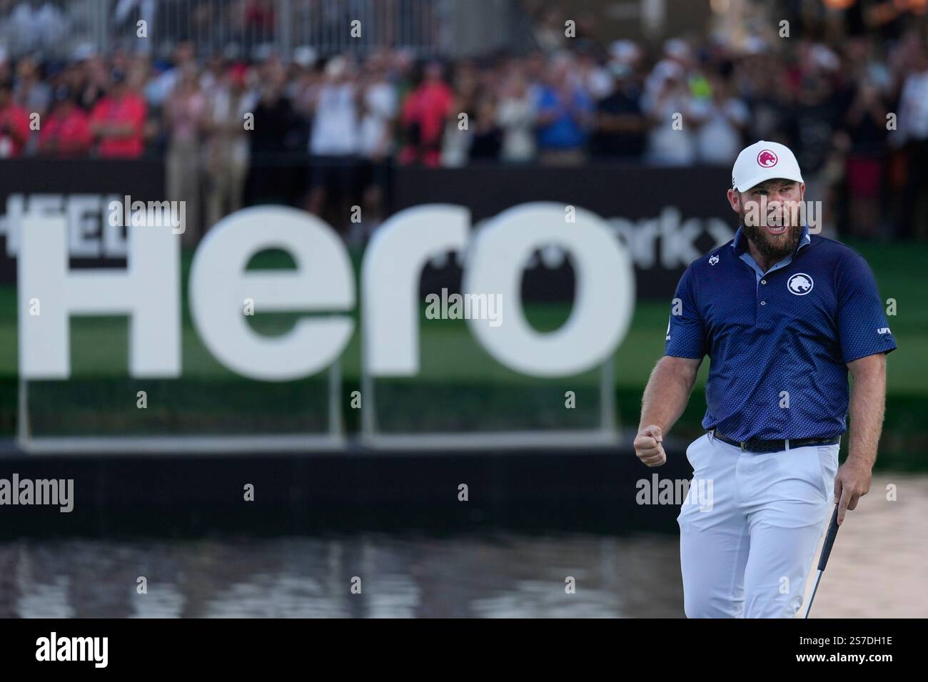 Tyrell Hatton of England reacts after winning the Dubai Desert Classic