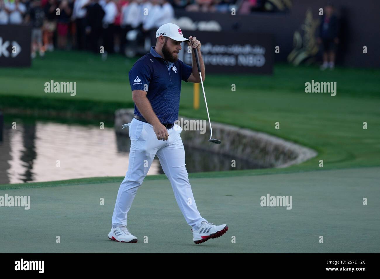 Tyrell Hatton of England walks after winning the Dubai Desert Classic