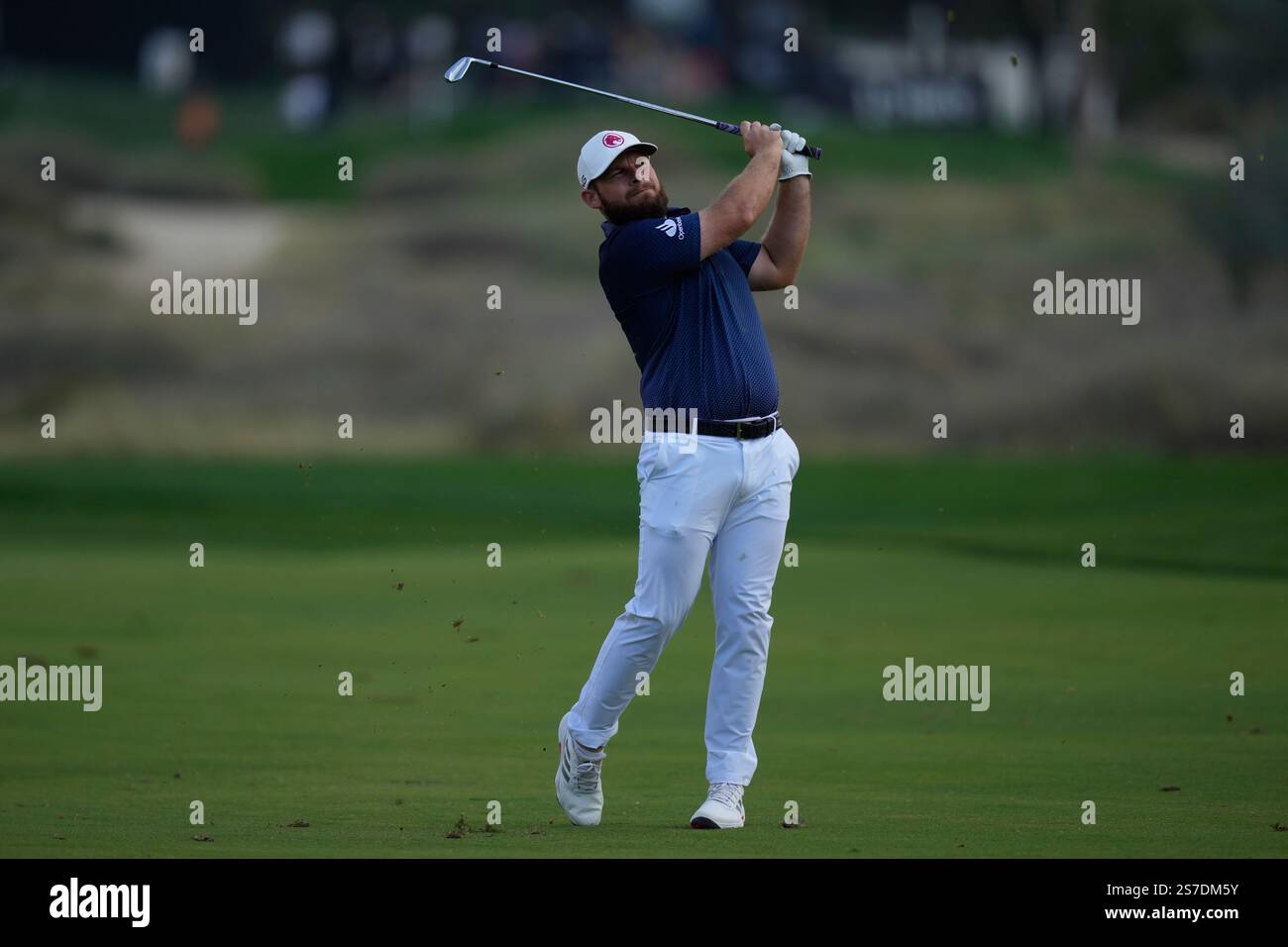 Tyrell Hatton of England plays his second shot on the 16th hole during