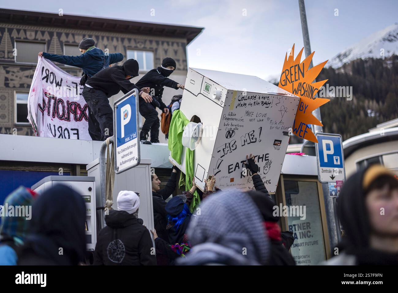 Protesters attend a demonstration before the annual meeting of the