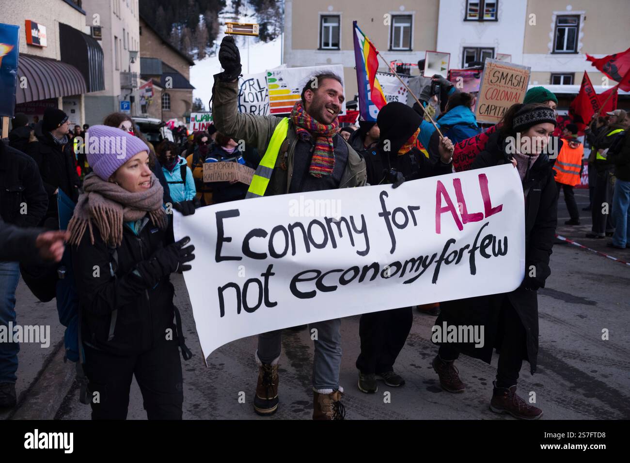 Demonstrators arrive for a protest ahead of the World Economy Forum in