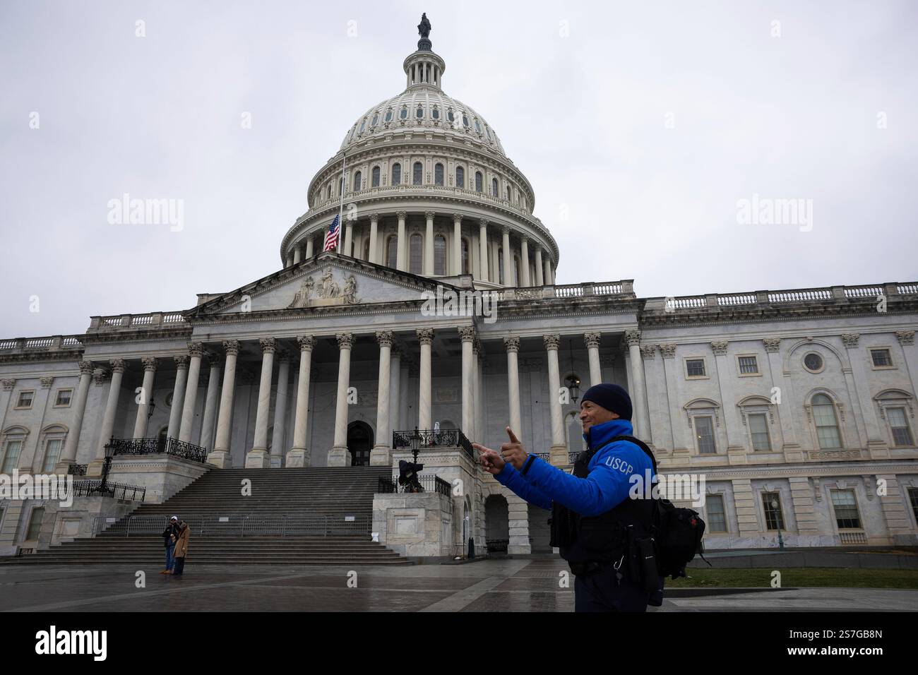 A U.S. Capitol Police officer directs pedestrians outside the U.S ...