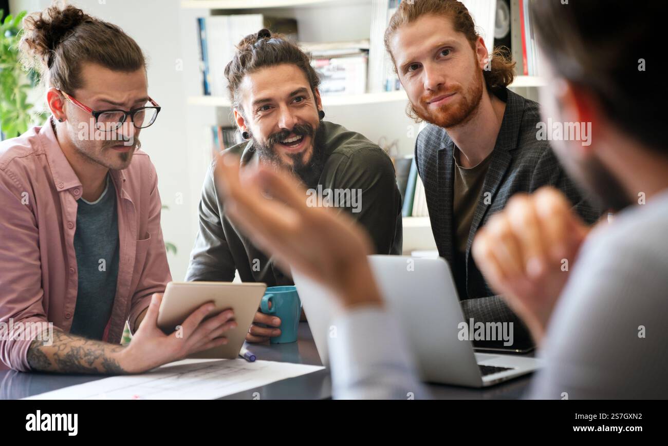 Happy software developers working on meeting, Programming advanced code artificial intelligence. Stock Photo