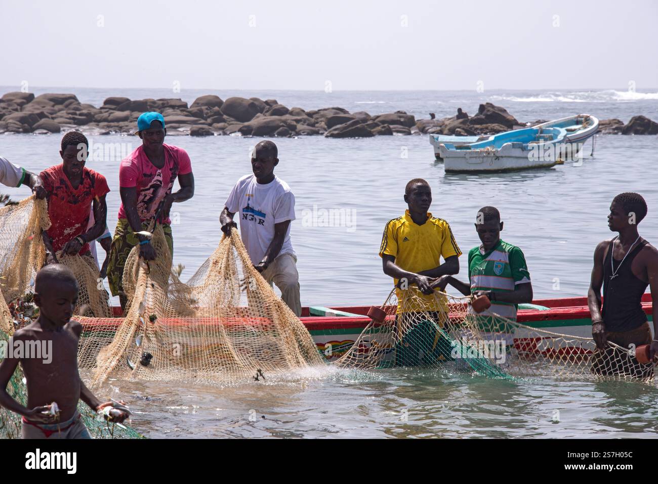 Group of men fishing with nets on the coast of Dakar, Senegal Stock ...