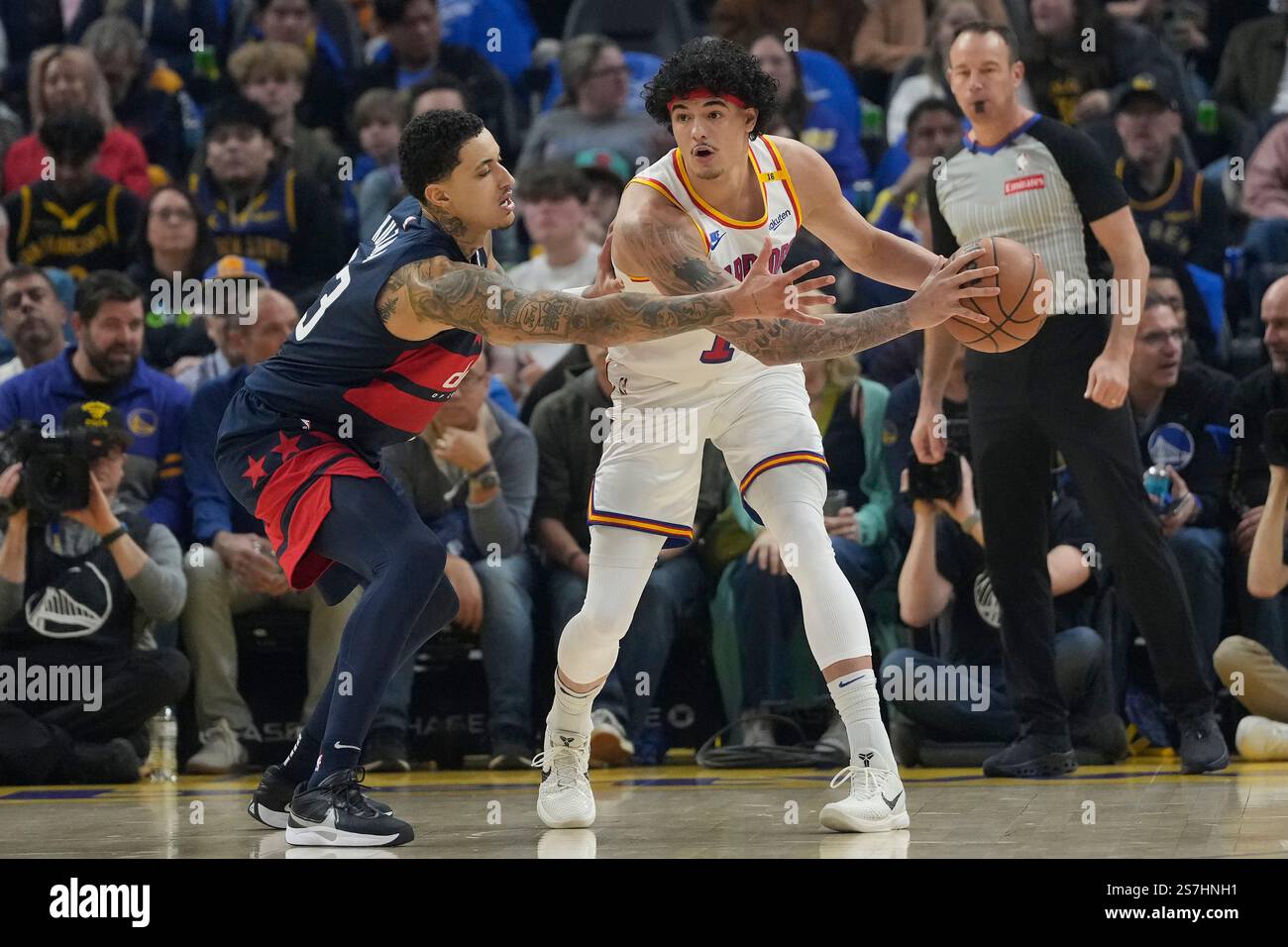 Washington Wizards forward Kyle Kuzma, left, defends Golden State