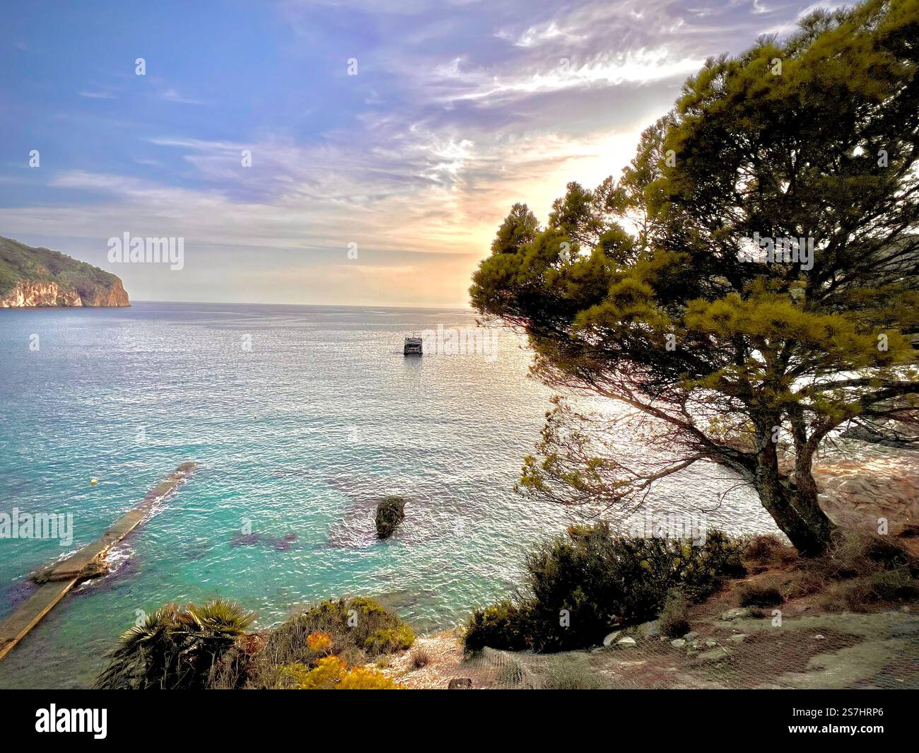 Looking down towards the turquoise ocean from the hillside - Smartphone Captured Stock Image