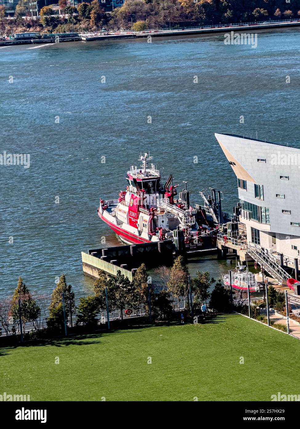 Fireboat Three Forty Three, at FDNY Marine 1 berth, Hudson River Pier 53 memorializes the 343 NYC firefighters lost on 9/11, New York City, NY, USA - Smartphone Captured Stock Image