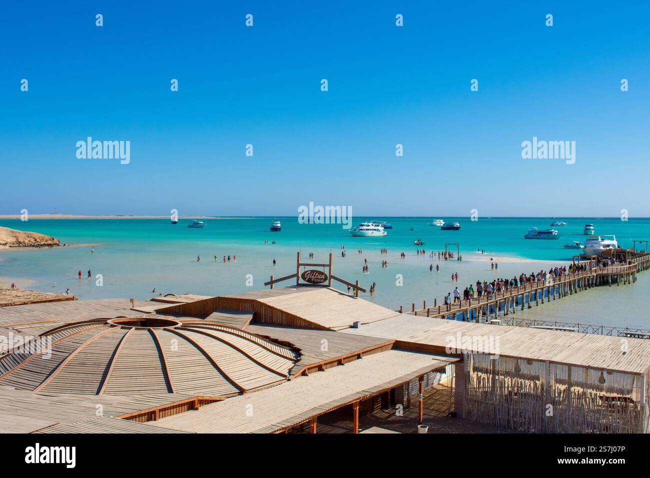21.01.24 Hurghada, Egypt: Cristal Clear turquoise water of Red Sea at Orange Bay in Giftun Island. Luxury Yachts near Beach at Hurghada, Egypt. Stock Photo
