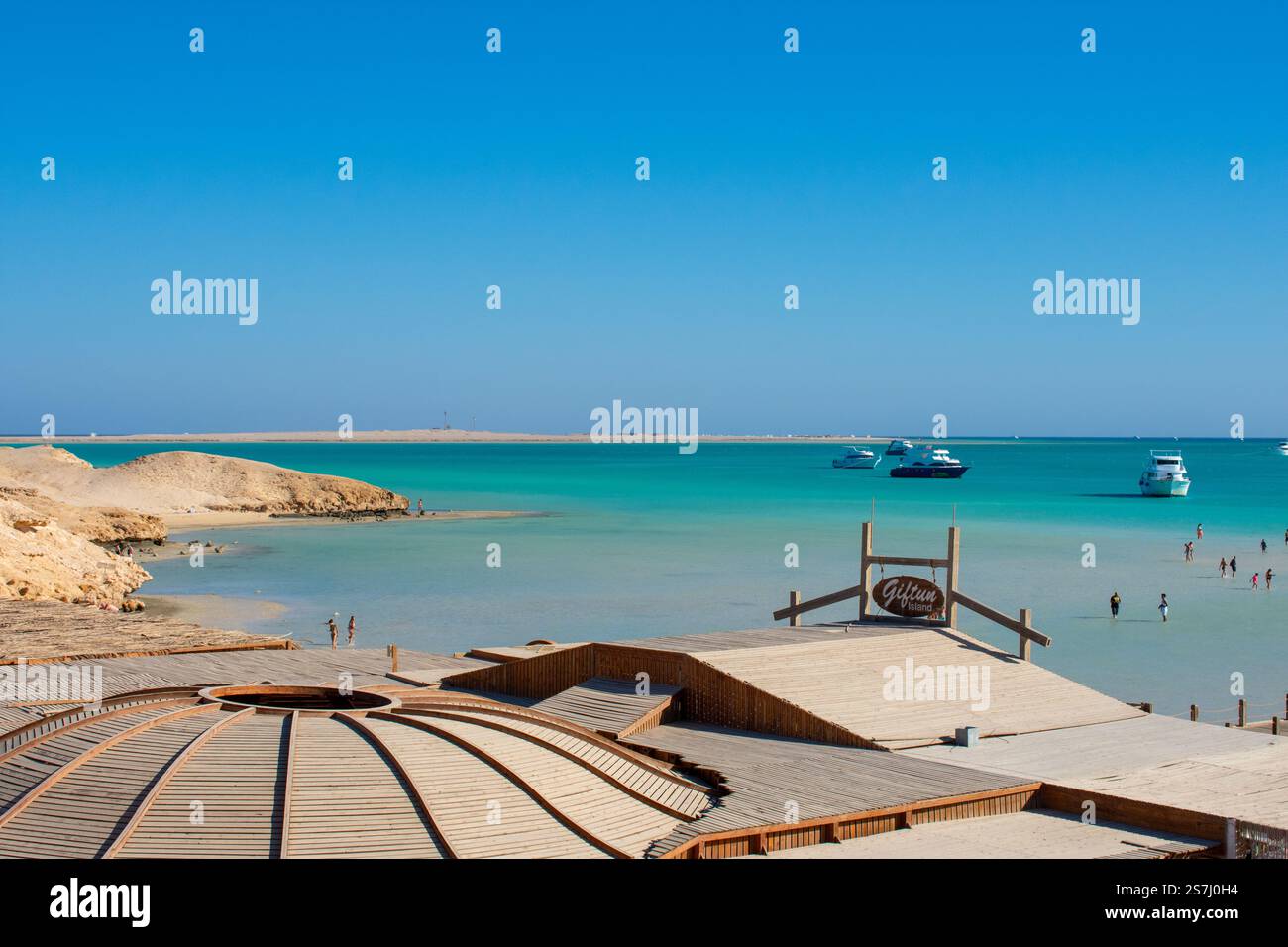 21.01.24 Hurghada, Egypt: Cristal Clear turquoise water of Red Sea at Orange Bay in Giftun Island. Luxury Yachts near Beach at Hurghada, Egypt. Stock Photo
