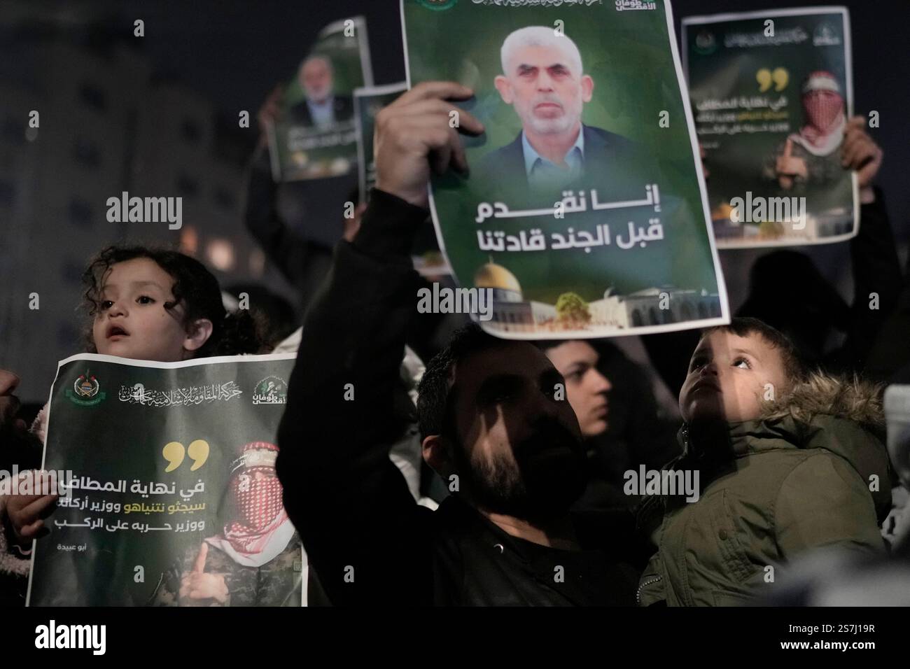 Palestinians react as they wait for the arrival of the released ...