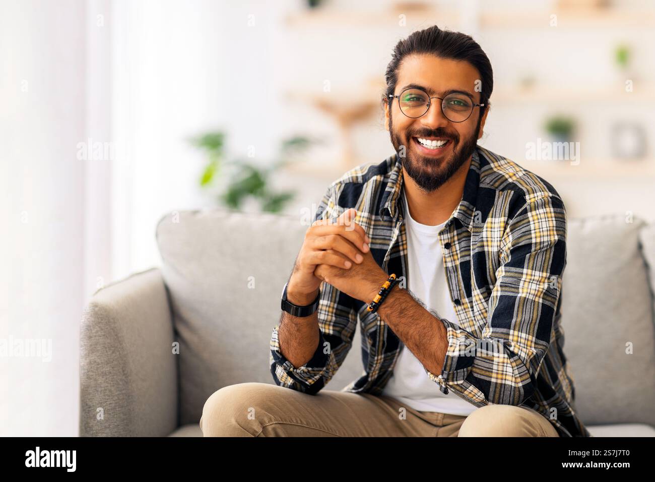 Handsome middle-eastern millennial man posing at home Stock Photo