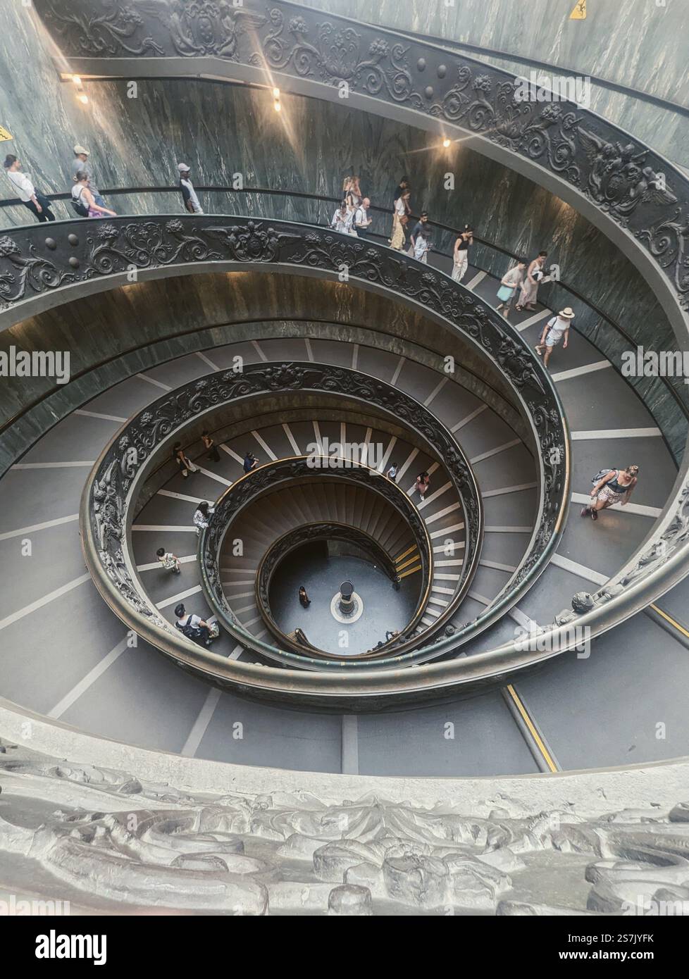 A mesmerizing spiral descent, where history and artistry intertwine, guiding visitors through the heart of architectural elegance. - Smartphone Captured Stock Image