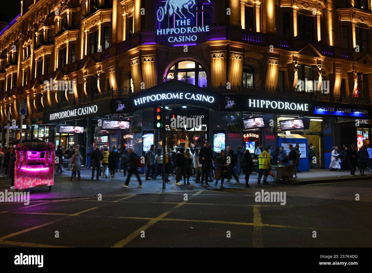 Illuminated Casino Front With Crowds at Night in London Stock Photo