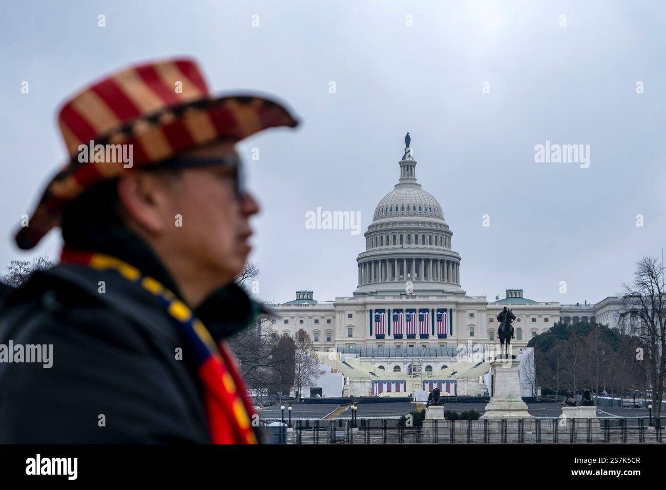 Washington, United States. 19th Jan, 2025. A man in an American flag cowboy hat walks past the U.S. Capitol in Washington, DC on Sunday, January 19, 2025. The 2025 Presidential Inauguration, which President-elect Donald Trump announced would be held in the U.S. Capitol Rotunda due to expected freezing temperatures, is only the second inauguration to be held indoors due to weather concerns. Photo by Bonnie Cash/UPI Credit: UPI/Alamy Live News Stock Photo